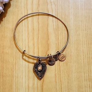 Guardian angel bangle in brushed metal gold tone, amber colored color crystal